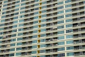 A tall building with many windows and balconies photo
