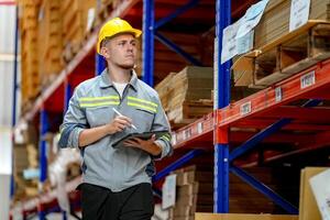 A man in a hard hat standing in a warehouse photo