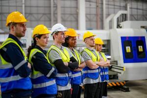 A group of people standing in front of a machine photo