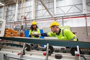 Two workers in a factory photo