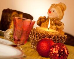Table with candle for Christmas dinner photo