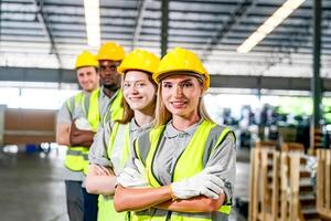 Group of smiling workers in a warehouse photo