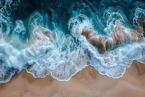 Aerial View of Ocean Waves Crashing on Sandy Beach for Summer Vacation Design photo