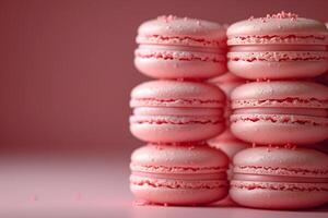 Pink Macarons Stacked Against a Soft Pink Background for Culinary and Dessert Themes photo
