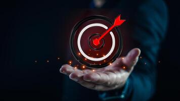 Motivation targets a circular target with an arrow placed precisely in the middle of the target. photo