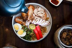 Instant food instant noodles with many seafood and boiled egg photo