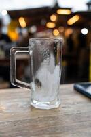 Empty beer mug covered with frost. photo