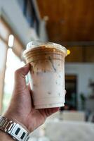 Cup of ice cafe latte with two layer, espresso and fresh milk photo