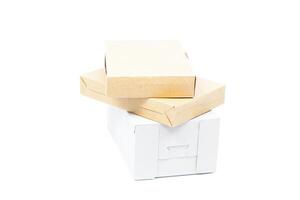 A stack of boxes and a white box photo