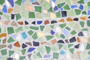 A mosaic tile pattern with many different colors photo