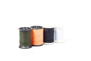 A spool of thread with different colors photo
