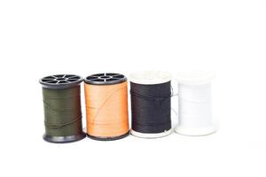 A spool of thread with different colors photo