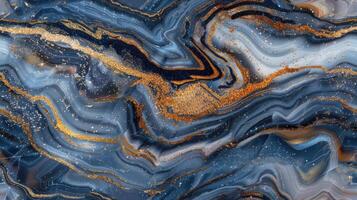 A blue and gold marble background with gold and black paint photo