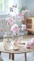 A table with a vase of flowers and a vase of water photo