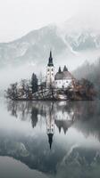 A church on an island in the middle of a lake photo