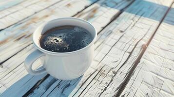 A cup of coffee on a wooden table photo