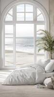 A bedroom with a large window overlooking the ocean photo