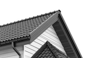 a house featuring black metal roof tiles with gable decoration, showcasing new modern architecture against an isolated background. photo