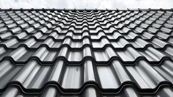 a house featuring black metal roof tiles with gable decoration, showcasing new modern architecture against an isolated background. photo