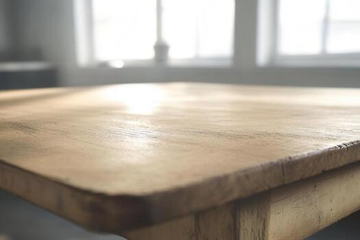 Close-up of a wooden table surface in a bright room. photo