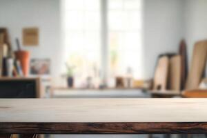 Blurred workspace with wooden table and background elements. photo