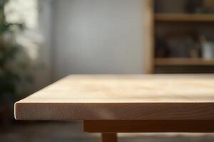 Close-up of a wooden table edge in a bright room. photo