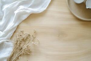 A serene tabletop with dried flowers and minimal decor. photo