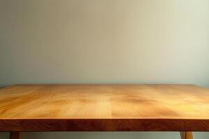 A simple wooden table against a plain wall. photo