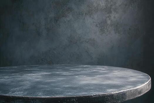 A circular table against a textured dark background. photo