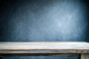 A wooden table against a textured blue background. photo