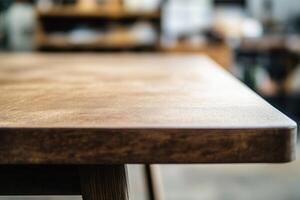 Close-up of a wooden table edge in a workspace. photo
