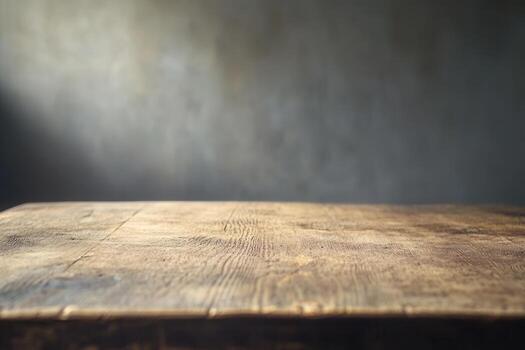 Rustic wooden table against a textured background. photo