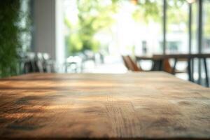 Soft-focus view of a wooden table in a bright space. photo