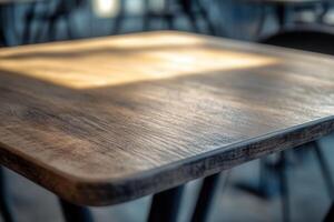 Close-up of a wooden table with soft lighting. photo