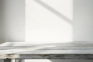Minimalist wooden table with natural light shadows. photo