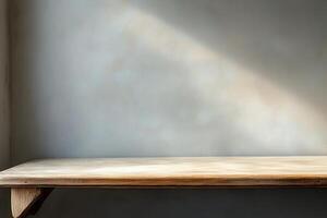 Minimalist wooden table against a textured wall. photo