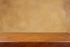 Simple wooden table against a textured beige wall. photo