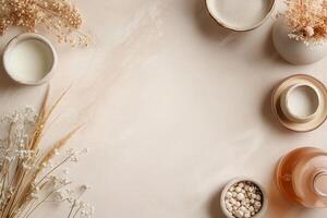 Soft pastel arrangement of beauty products and botanicals. photo
