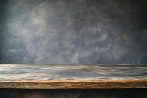 Rustic wooden table with textured background. photo