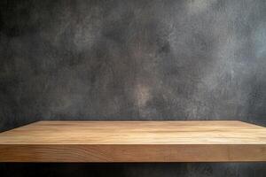 Wooden tabletop against a textured dark wall background. photo