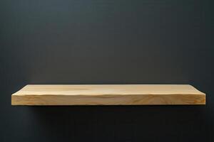 Simple wooden shelf against a dark background. photo