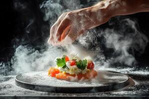 Chef's hands dusting smoked salmon dish with white powder, creating smoky effect. photo