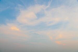 A man standing on a beach with a kite in the sky photo
