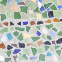 A mosaic tile pattern with many different colors photo