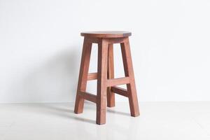 A wooden stool with a white background photo