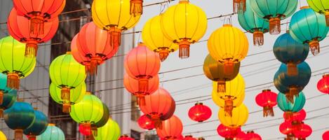 Colorful chinese lanterns hanging from a string photo