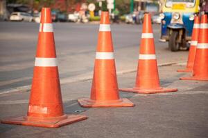 A row of orange traffic cones photo