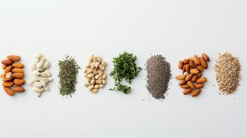 Organic seeds, nuts, and herbs are arranged neatly on a white surface, with ample space available for additional text or design elements. photo