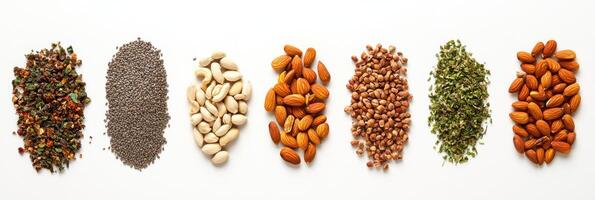 An assortment of organic seeds, nuts, and herbs neatly placed on a white background, offering clear space for custom text or branding. photo