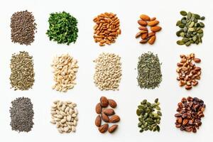 Variety of organic seeds, nuts, and herbs arranged neatly on a white surface, providing ample empty space for text. photo
